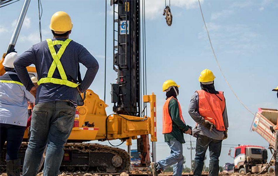 Construction crew and equipment on a commercial job site